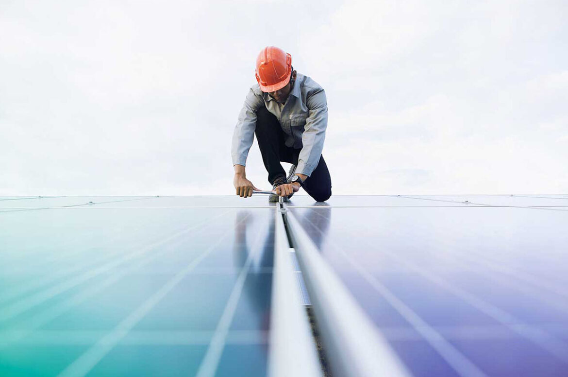 Solar contractor doing work on a solar panel