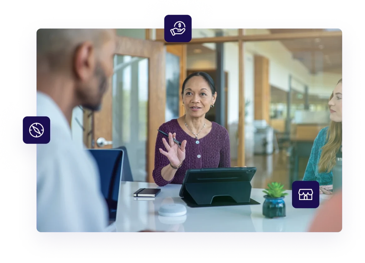 Female business owner discussing her strategy for getting a business loan with colleagues