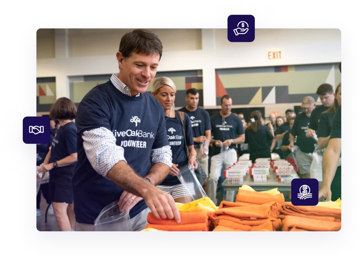 Live Oak Bank employees demonstrating the organization's corporate philanthropy by volunteering at a local community event
