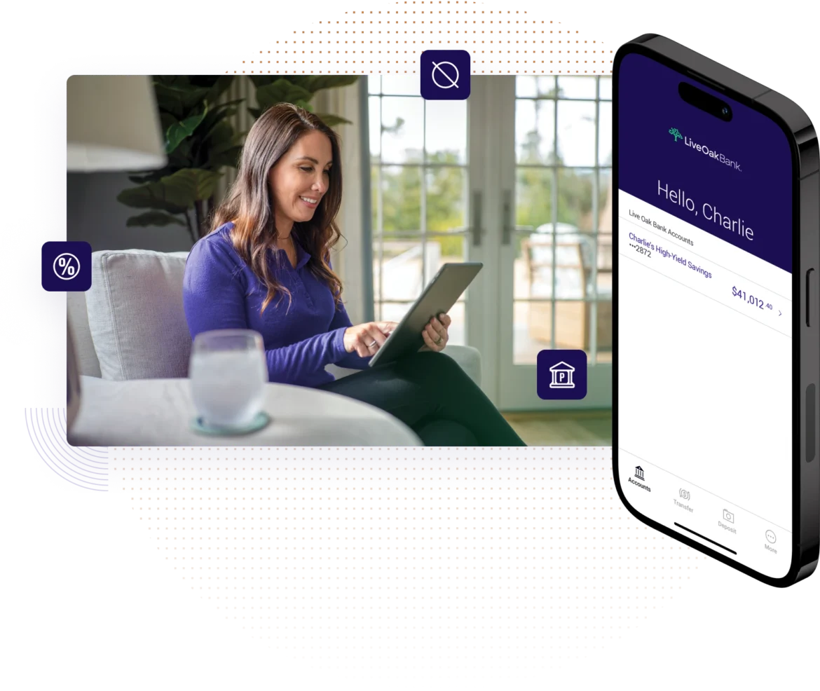 Female sitting casually in her home living room looking at personal savings accounts on her tablet