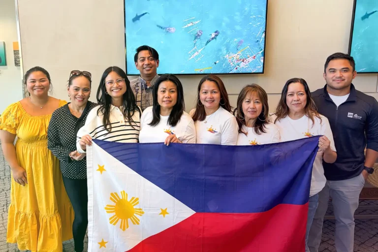 Representatives from Live Oak Bank's Asian American Pacific Islander Community employee resource group pose for a photo during a Merienda event to celebrate Filipino American History month