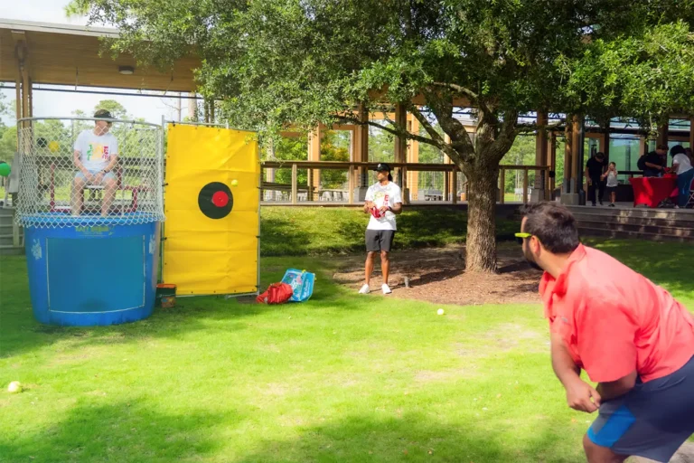 Live Oak Bank employees participate in a water dunk tank activity during an employee resource group Juneteenth event