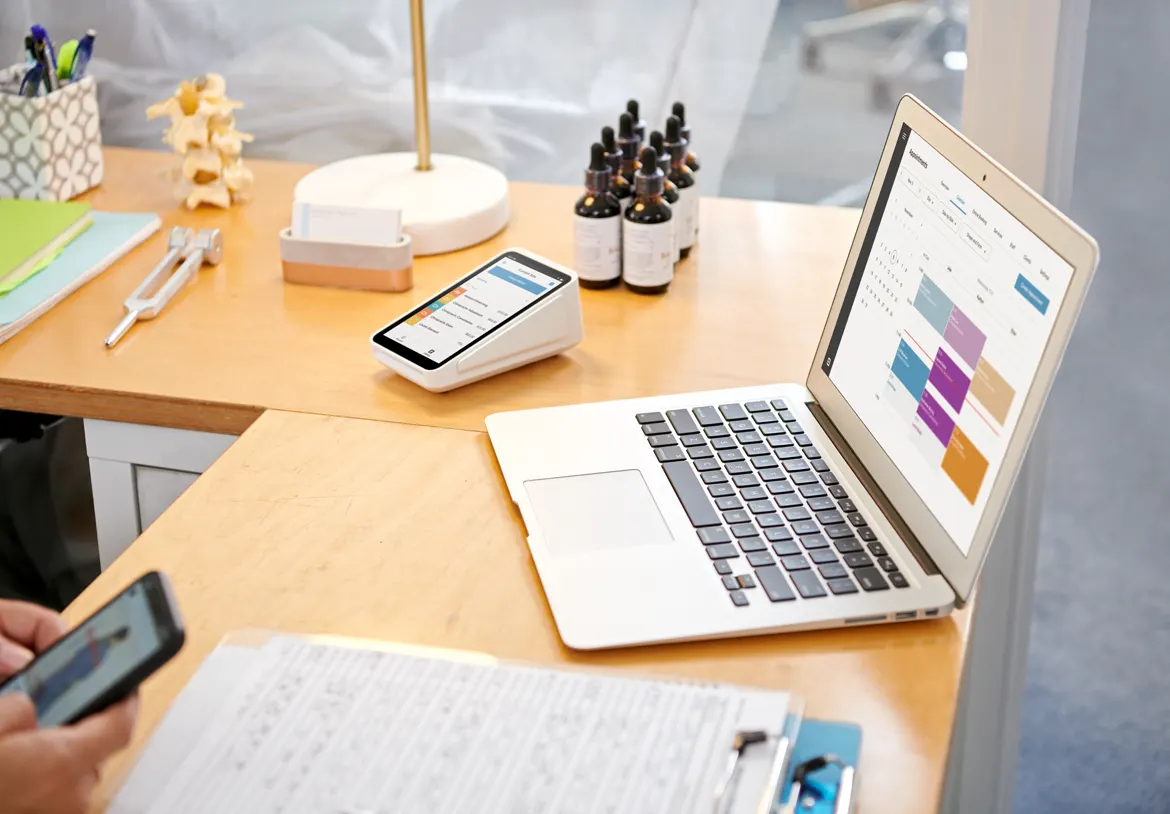 Integrated payment device and business management platform help a small business track appointments and process payments.